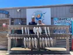 Anglers with 8 black drum and spotted weakfish fish caught in TX