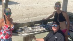 Three people enjoying a fishing trip in Corpus Christi