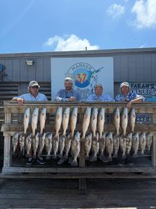 Successful fishing trip displaying black drum, redfish, and freshwater drum catch in Corpus Christi TX
