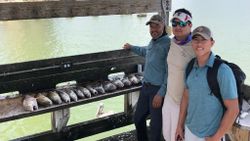 Three people enjoying a fishing trip in Corpus Christi