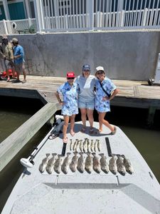 5 people enjoying a fishing trip in Corpus Christi