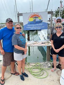 Four friends enjoying a fishing trip in FL