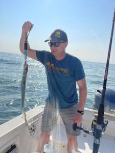 Angler enjoying fishing trip in Kitty Hawk
