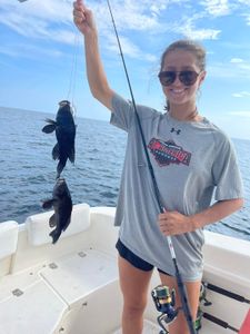 Two sea bass caught while fishing in Kitty Hawk