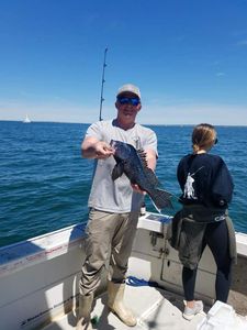 A lone fisherman from Fairhaven with their fishing rod