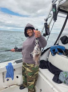 A person fishing in Fairhaven
