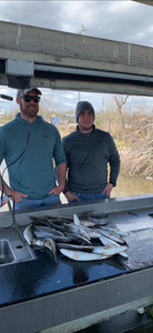 Two people fishing at Lake Charles