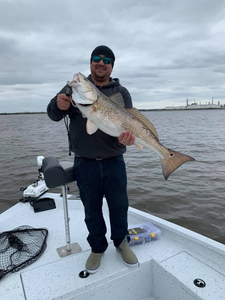 A person fishing in Lake Charles