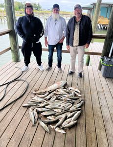 3 people fishing at Lake Charles