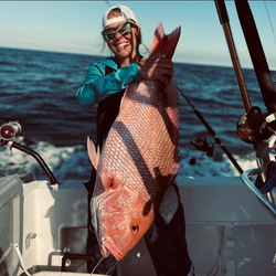 Angler with fishing rod in Carrabelle
