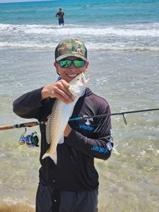 Two anglers fishing on the beach at South Padre Island