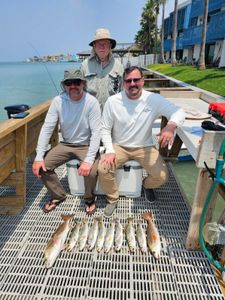 3 people fishing on the beach at South Padre Island