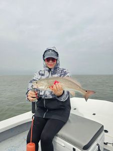 Angler holding a 25-inch redfish in Texas
