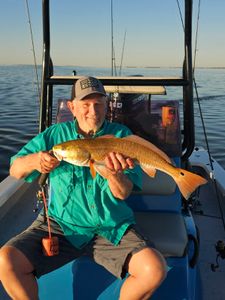 Lone fisherman in TX catching a 22-inch fish