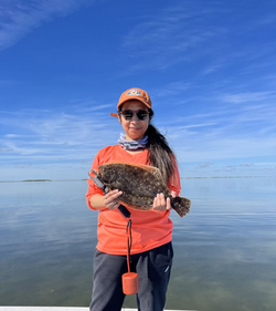 Image of a 14-inch summer flounder caught while fishing at South Padre Island