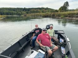 Fishing boat on river in Fruitport MI with anglers enjoying day on water