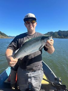 A lone angler fishing for a lake trout in Oregon
