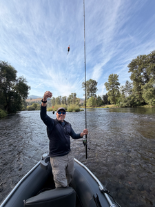 Bait casting action on Oregon waters under clearing skies.