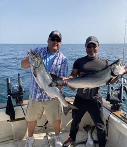 Two anglers with three fish they caught in South Haven