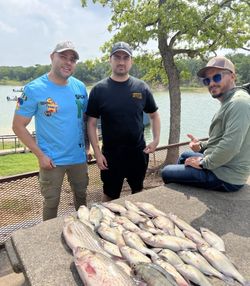 Three people fishing in TX