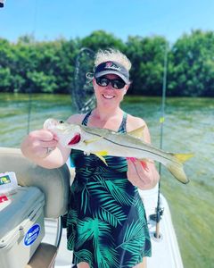 A photograph of a 22-inch Snook fish caught in Chesapeake