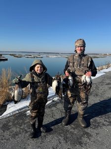 Three people enjoying a fishing cruises, fishing, hunting, tours adventure in Chesapeake