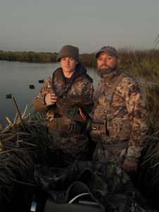 Two people enjoying fishing, cruises, hunting and tours in Florida
