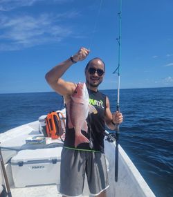 Single angler fishing at orange beach