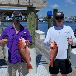 Two anglers with four Spanish mackerel in Orange Beach