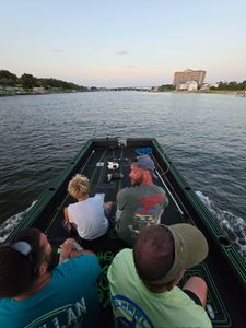 Fishing boat cruising on water near Orange Beach Alabama with anglers aboard