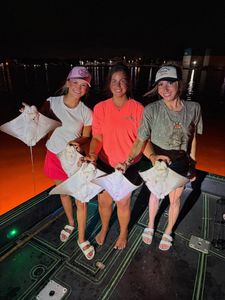 Night fishing trip on boat in Orange Beach Alabama with catch display