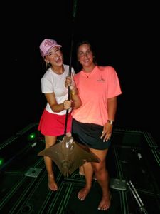 Fishing catch of stingray on boat deck at night in Orange Beach AL