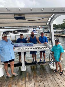 Five people enjoying a fishing trip in Florida