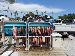 Red snapper fishing catch displayed on boat rack in Shalimar FL