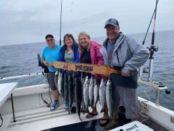 4 people catching 2 big fish in Mexico