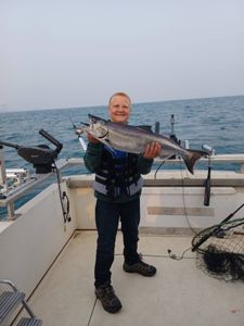 A person fishing for a Chinook Salmon in NY