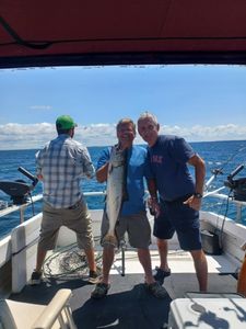 Coho salmon caught by two people in Mexico