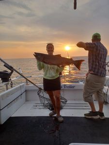 One fisherman reeling in his catch in NY