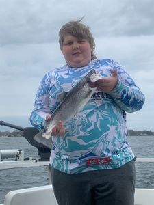 Angler catching a Rainbow Trout in NY