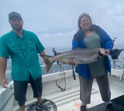 Anglers fishing in Mexico with a 23-inch catch