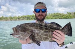 Reeling In a prized Grouper Catch!