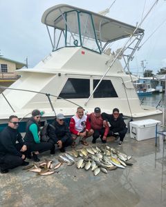 Group of 6 people fishing on the coast in FL