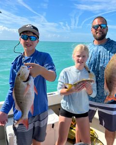 Two anglers fishing with rod and reel in Marathon, Florida