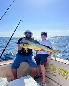 Two anglers enjoying a successful fishing trip in Marathon
