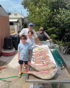 2 big fish caught by 4 people in Marathon