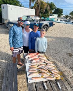 group of friends fishing in the sunshine in FL