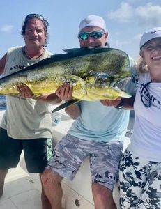 A group of 3 people fishing in Marathon