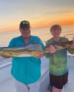 Two people fishing for bass in Marathon, Florida