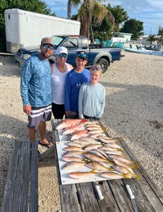 4 people fishing in Marathon, Florida