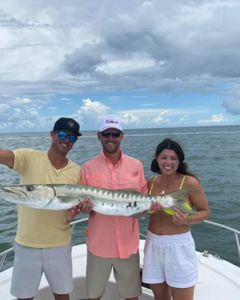 Three anglers with a large fish caught in Florida